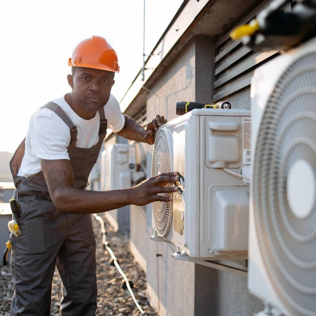 American Mechanical Systems HVAC technician servicing a system in Naperville, IL